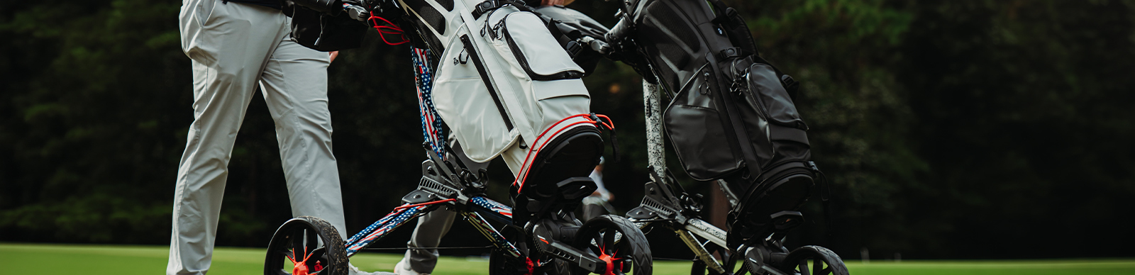 How playing style affect your golf bag choice - golfer walking on the golf course with a cart bag on a push cart
